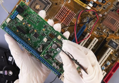 close-up-hands-holding-hardware-components