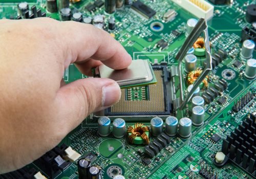 CPU in hand before installation into the motherboard.